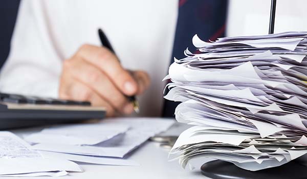 Stack of bills Stack of papers on desk